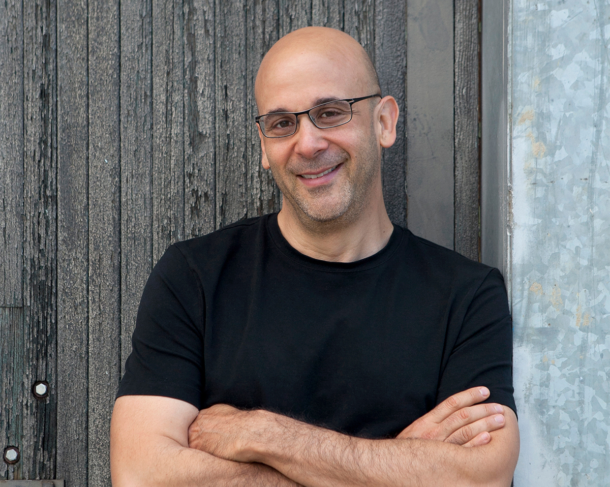 the founder of the tonic in a black shirt with their arms crossed